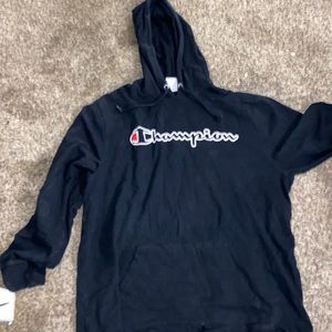 a champion hoodie, it’s black and i never wore it and don’t know whose it is